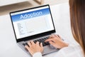 Woman Filling Adoption Paternity Registry In Laptop