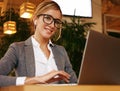 Businesswoman Working On Laptop In Coffee Shop. Young business w Royalty Free Stock Photo