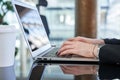 Business woman working on laptop in the office. Close up image hands typing Royalty Free Stock Photo