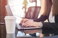 Businesswoman working on laptop in the office. Close up image of female office worker`s hand typing Royalty Free Stock Photo