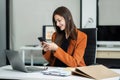 Businesswoman working with laptop, smartphone, and tablet. modern digital workspace concept