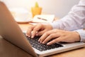 Businesswoman working with notebook laptop computer, using finger with keyboard for typing or keying Royalty Free Stock Photo