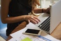 Businesswoman working in office using laptop, mid section Royalty Free Stock Photo