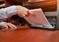 Businesswoman  working with printer in the office Royalty Free Stock Photo