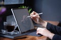 Businesswoman working with stylus and digital tablet pc at a coffee shop