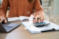 Businesswoman working with tablet and using a calculator to calculate the numbers of static in office. Finance accounting concept Royalty Free Stock Photo