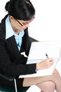 Businesswoman writing in notebook Royalty Free Stock Photo
