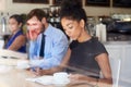 Businesswoman Writing Notes In Coffee Shop Royalty Free Stock Photo