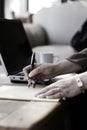 Businesswoman Writing Notes in Hotel Atrium Royalty Free Stock Photo