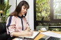 Businesswoman writing or pointing on report paper. Business strategy concept. Close up shot businesswoman writing notes in Royalty Free Stock Photo