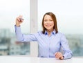 Businesswoman writing something in the air Royalty Free Stock Photo