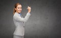 Businesswoman writing something in air with marker Royalty Free Stock Photo