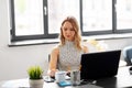 Businesswoman writing to notebook at office Royalty Free Stock Photo