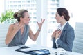 Businesswoman yelling at colleague