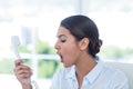 Businesswoman yelling at her phone Royalty Free Stock Photo