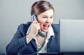 Businesswoman yelling into the phone Royalty Free Stock Photo