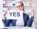 Businesswoman with yes message in office Royalty Free Stock Photo