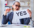 Businesswoman with yes message in office Royalty Free Stock Photo