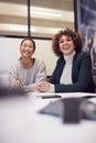 Businesswomen Collaborating In Creative Meeting Around Table In Modern Office Royalty Free Stock Photo