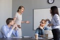 Businesswomen colleagues disputing at corporate office meeting, Royalty Free Stock Photo