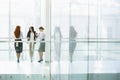 Businesswomen conversing at office hallway