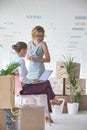 Businesswomen discussing amidst cardboard boxes at new