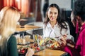 Businesswomen eating tasty salads and drinking lemonade for lunch