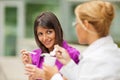 Businesswomen eating yogurt Royalty Free Stock Photo