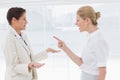 Businesswomen fighting in the office Royalty Free Stock Photo