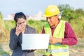 Businesswomen and foreman talking together and happy funny. Engineer and manager teamwork and checking at site construction Royalty Free Stock Photo