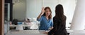 businesswomen giving hi five touching hands and thumb up during meeting for celebration business achievement and success