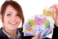 Businesswomen with group of money. Royalty Free Stock Photo
