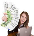 Businesswomen with group of money and laptop. Royalty Free Stock Photo