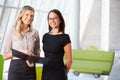 Businesswomen Having Informal Meeting In Modern Office Royalty Free Stock Photo