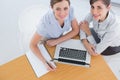 Businesswomen having a meeting and looking up at camera Royalty Free Stock Photo