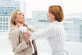 Businesswomen having a violent fight in office Royalty Free Stock Photo