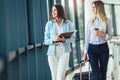 Businesswomen hold luggage travel to business trip