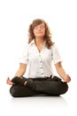 Businesswomen meditating in lotus position Royalty Free Stock Photo