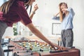 businesswomen playing table football