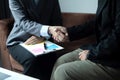 The businesswomen shake hands after the meeting was successful and agreed upon