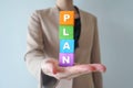 Businesswomen show Plan words on wooden cube