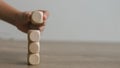 Businesswomen stack blank wooden cubes on the table with copy space, empty wooden cubes for input wording, and an infographic icon Royalty Free Stock Photo