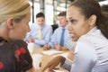 Businesswomen Talking To Each Other During Meeting Royalty Free Stock Photo