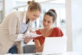 Businesswomen working on laptop