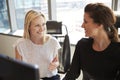 Businesswomen Working At Office Desk On Computer Together Royalty Free Stock Photo