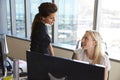 Businesswomen Working At Office Desk On Computer Together Royalty Free Stock Photo