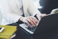 Businesswomen working in office, young hipster manager typing on keyboard, female hands texting message, work process concept