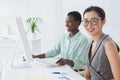 Businesswomen working together at desk