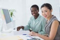 Businesswomen working together at desk