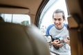 busker holding the ukulele approached the windshield when the car stopped Royalty Free Stock Photo